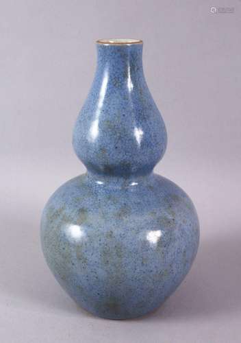 A CHINESE MONOCHROME PALE BLUE GLAZED PORCELAIN GOURD VASE, ...