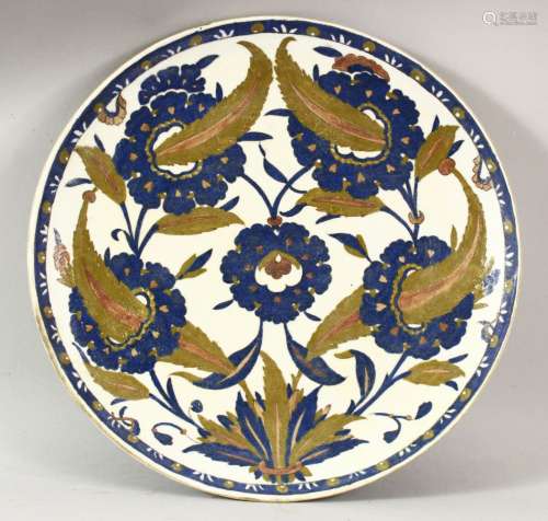A TURKISH IZNIK POTTERY PLATE - decorated with floral patter...