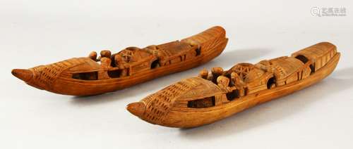 A PAIR OF CHINESE CARVED BAMBOO BOATS, both 28cm long.