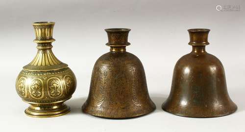 THREE INDIAN BRASS HUQQA BASES, each with engraved / chased ...