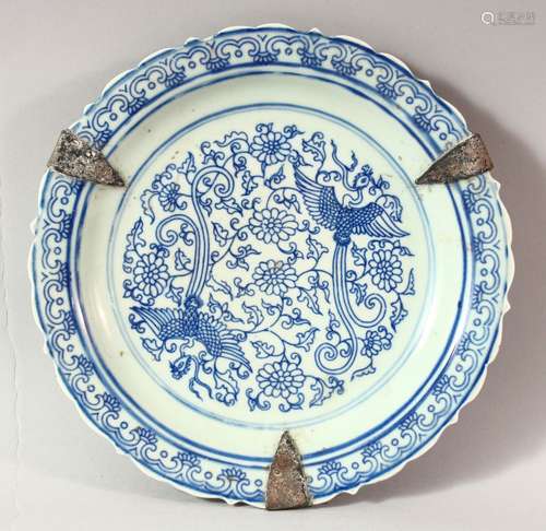 A CHINESE BLUE AND WHITE PORCELAIN DISH, the centre decorate...