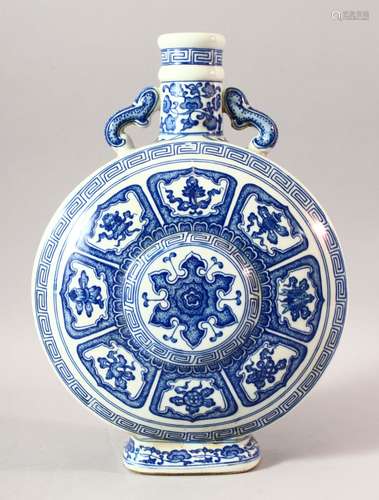 A CHINESE BLUE AND WHITE PORCELAIN TWIN HANDLE MOONFLASK, de...