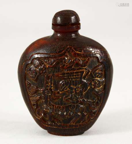 A CHINESE HORN SNUFF BOTTLE AND STOPPER, carved with two pan...