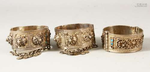 THREE 19TH CENTURY OTTOMAN BALKANS SILVER BANGLES, inset wit...