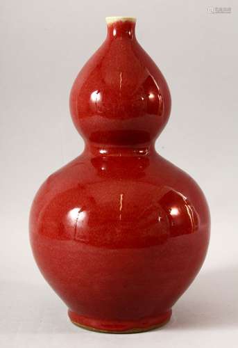 A CHINESE RED GLAZED DOUBLE GOURD VASE, six character mark t...