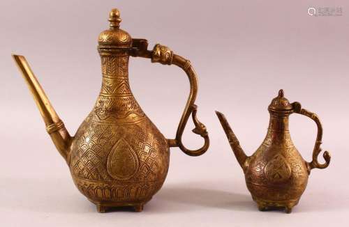 TWO NORTH AFRICAN BRONZE / BRASS CHASED DECORATED EWERS, 17c...