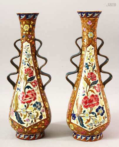 A PAIR OF IZNIK STYLE TAPERING VASES, with wavy handles, 36c...