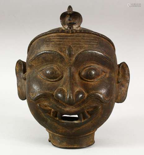 A LARGE 17TH/18TH CENTURY INDIAN BRONZE SHIVA MASK, 22cm.