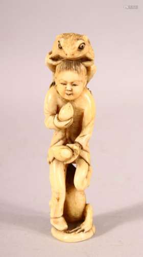 A JAPANESE CARVED IVORY OKIMONO of a boy eating peaches with...