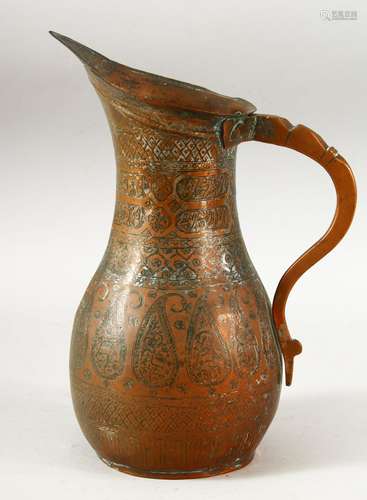 A 19TH CENTURY PERSIAN QAJAR COPPER JUG, 24.5cm high.