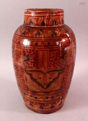A LARGE NORTH AFRICAN RED GLAZED POTTERY VASE, with floral m...