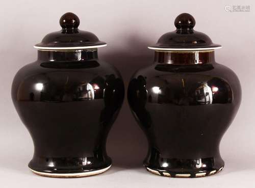 A PAIR OF CHINESE FAMILLE NOIR PORCELAIN GINGER JARS & COVER...