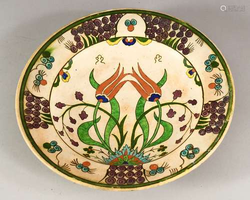 AN IZNIK STYLE POTTERY DISH, possibly European, decorated wi...