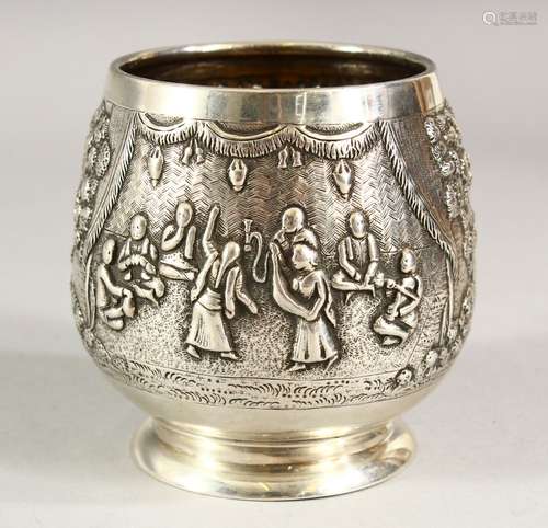 A SMALL EASTERN SILVER PEDESTAL BOWL, embossed decoration de...