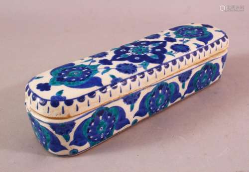 A TURKISH OTTOMAN KUTAHYA POTTERY PEN BOX & COVER, in blue a...