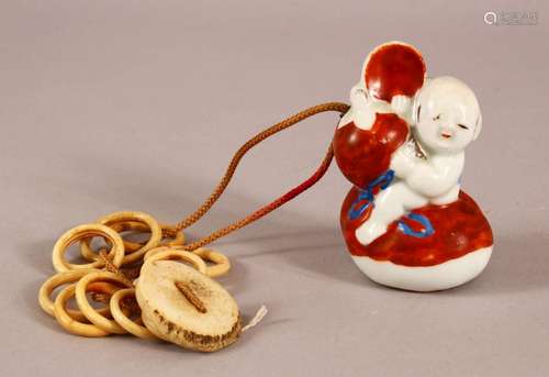 A 19TH CENTURY JAPANESE MEIJI PERIOD PORCELAIN NETSUKE OF A ...