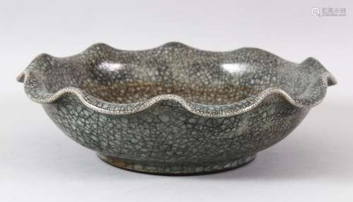 A LARGE CHINESE CRACKLE GLAZE BOWL, with wavy rim, the base ...