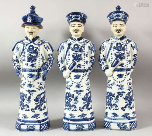 THREE LARGE CHINESE BLUE & WHITE PORCELAIN EMPEROR FIGURES, ...