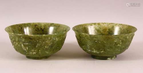 A GOOD PAIR OF CHINESE JADE BOWLS, the sides carved with ho-...