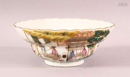 A CHINESE FAMILLE VERTE PORCELAIN BOWL, the sides painted wi...