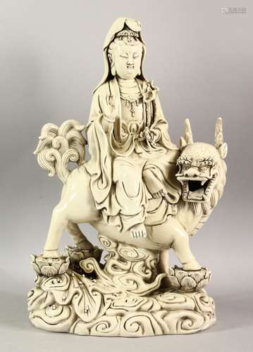 A CHINESE DEHUA PORCELAIN GUANYIN FIGURE - depicting the god...