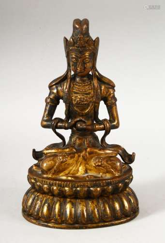 A CHINESE GILT BRONZE FIGURE OF BUDDHA / DEITY - in a seated...