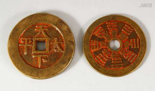 TWO CHINESE CURRENCY COINS - with residual poly chrome decor...