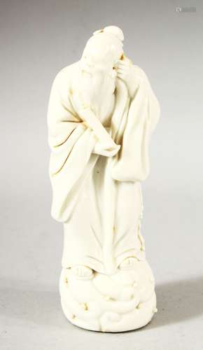 A SMALL CHINESE BLANC DE CHINE FIGURE OF A SAGE, 14.5cm high...