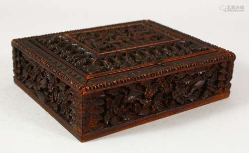 A SMALL EASTERN CARVED WOOD BOX, the interior with fitted co...