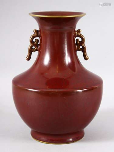 A CHINESE PORCELAIN RED GROUND BALUSTER FORM VASE, with unus...