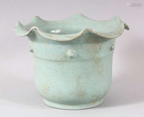 A CHINESE SONG STYLE CELADON PLANT POT, with circular script...