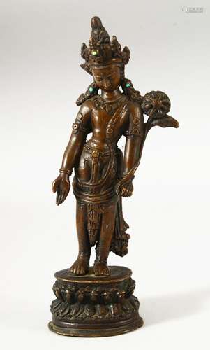 A SMALL INDIAN BRONZE FIGURE OF A DEITY, the head dress inse...