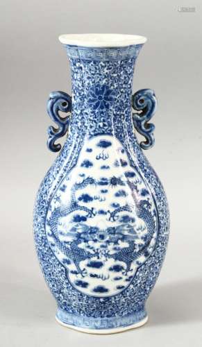 A CHINESE BLUE & WHITE PORCELAIN TWIN HANDLE VASE, decorated...