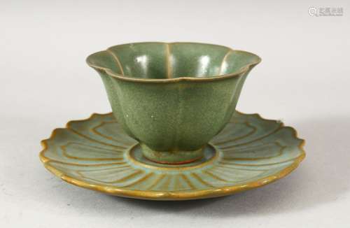 A CHINESE CELADON TEA CUP AND SAUCER, the cup 8.5cm diameter...