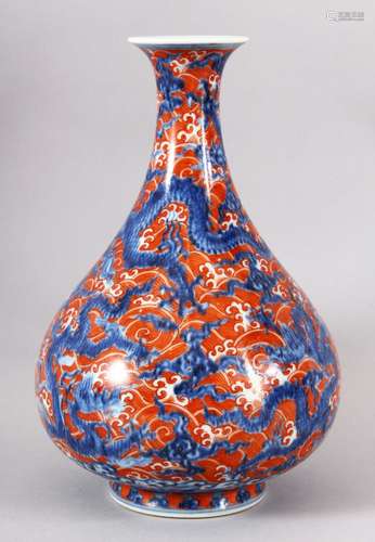 A CHINESE IRON RED AND BLUE YUHUCHUN VASE, the body painted ...