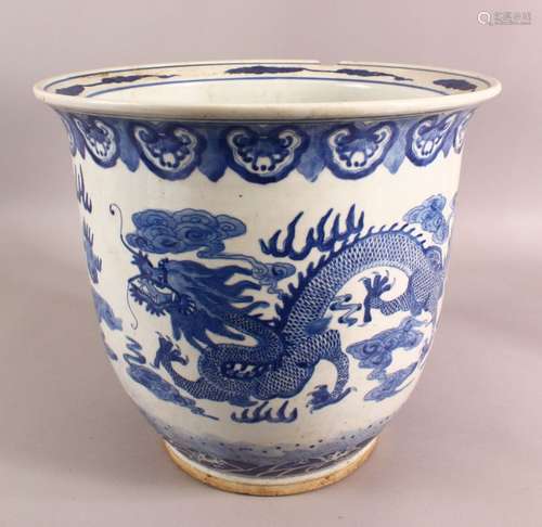 A LARGE CHINESE BLUE AND WHITE PLANTER, the body decorated w...