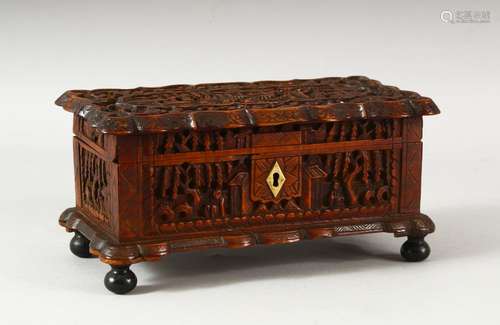 A CHINESE CANTON CARVED WOOD BOX, the lid carved with a pane...