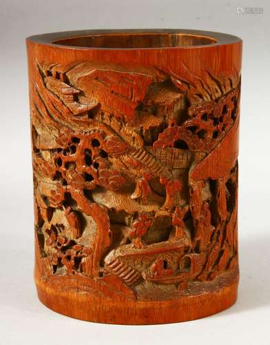 A CHINESE CARVED BAMBOO BRUSH POT, the body carved with land...