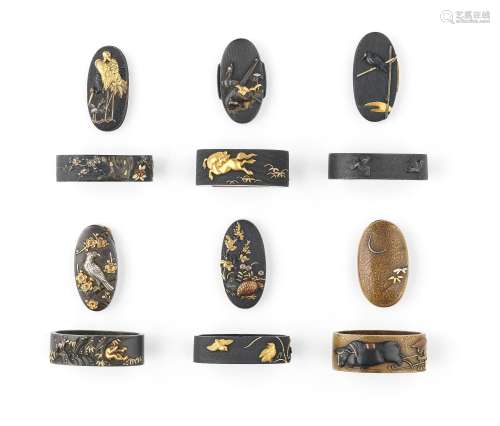 Four fuchi-gashira (hilt collars and pommels) and a fuchi (h...