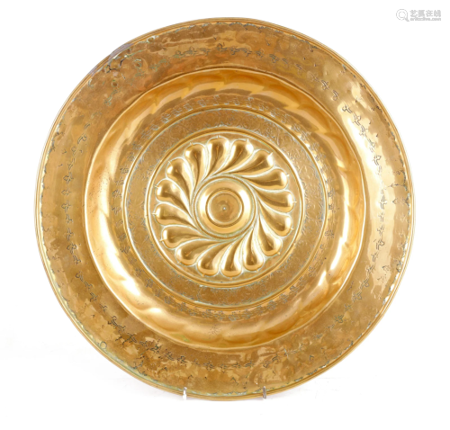A 16TH CENTURY NUREMBERG BRASS ALMS DISH with a
