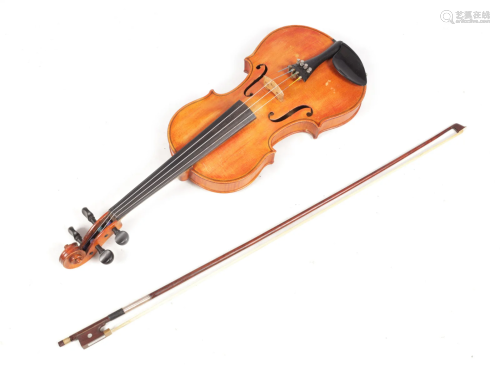 AN ANTIQUE VIOLIN having a two-piece back and in a