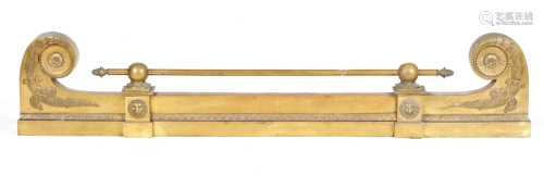 A REGENCY BRASS HEARTH FENDER with scrolled ends and
