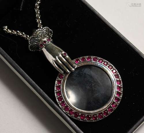 A SILVER RUBY HAND MAGNIFYING GLASS.