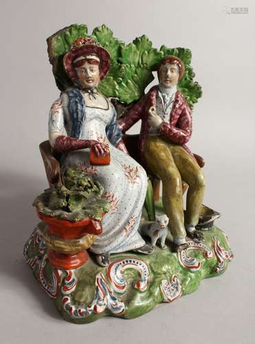 A GOOD PRATTWARE GROUP, A MAN AND WOMAN ON A BENCH a dog by ...