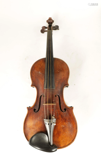 AN ANTIQUE VIOLIN bearing the old torn label, sold with