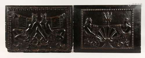 AN EARLY PAIR OF CARVED METAMORPHIC BLACK WOODEN PANELS. The...