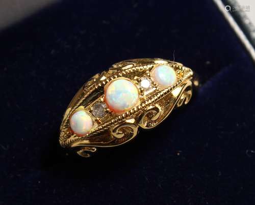 A GOLD PLATED OPAL AND DIAMOND RING.