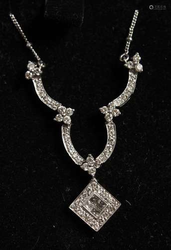 AN 18CT GOLD AND DIAMOND PENDANT AND CHAIN