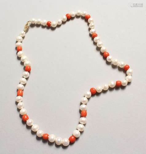 A STRING OF PEARL AND CORAL BEADS with 14ct gold clasp.