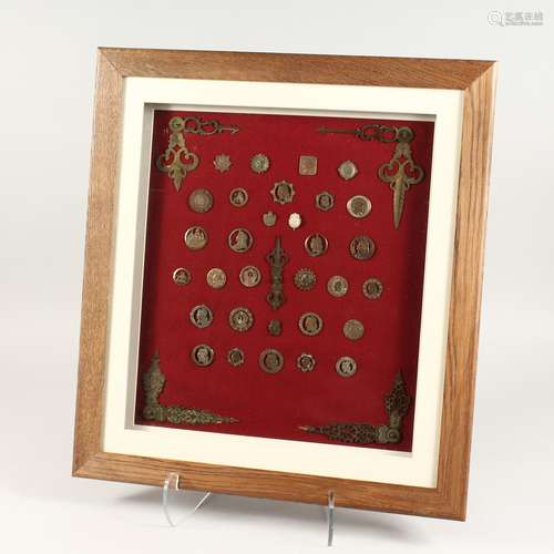 A COLLECTION OF FRAMED COINS, TIE PINS, BUTTONS, MEDALLIONS,...